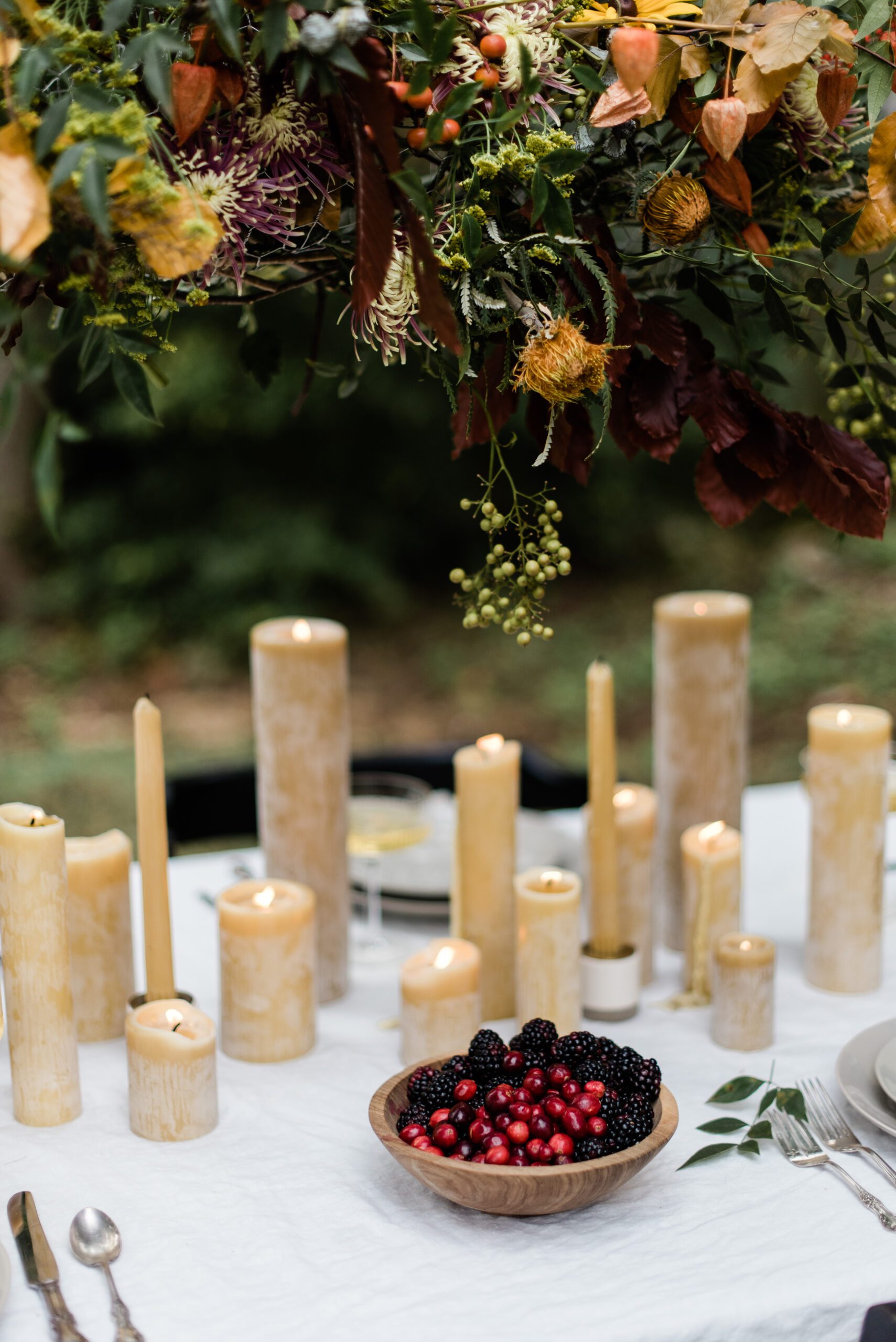 beeswax candle centerpiece on outdoor table