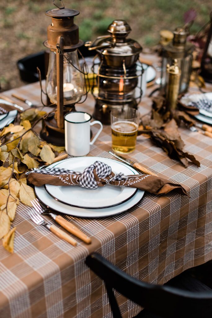 rustic Thanksgiving table place setting in fall earth tones and plaid