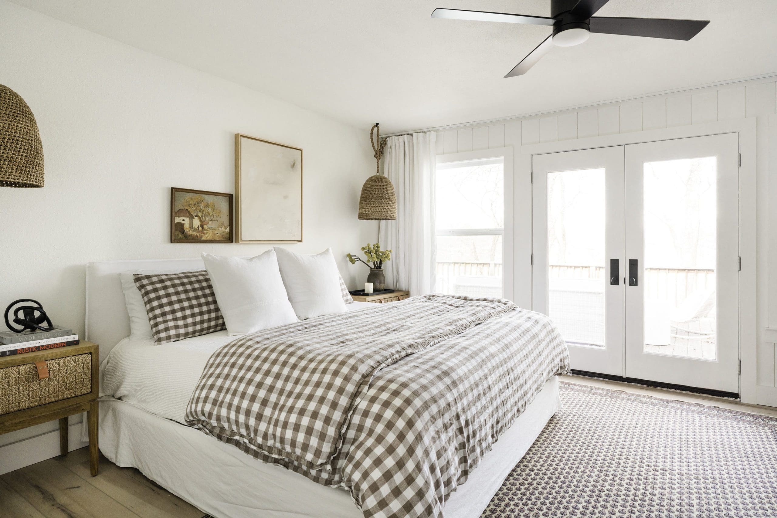 An Earth Tone Lake House Primary Bedroom - The Interior Collective