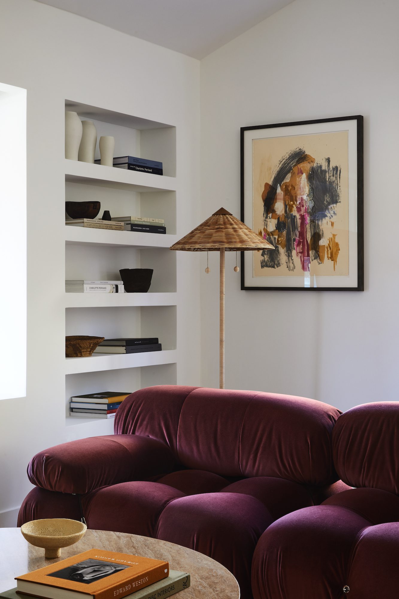 cool modern california living room with red velvet sofa