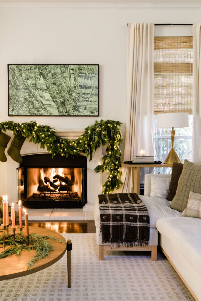 Classic green holiday decorating with cypress wreath on mantle
