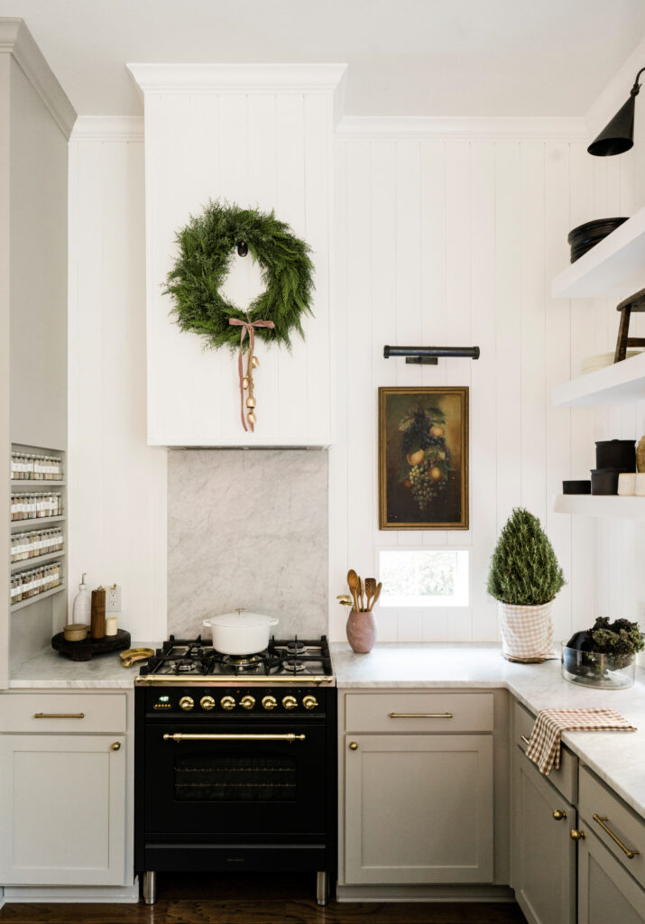 Fresh wreath over kitchen stove holiday home tour