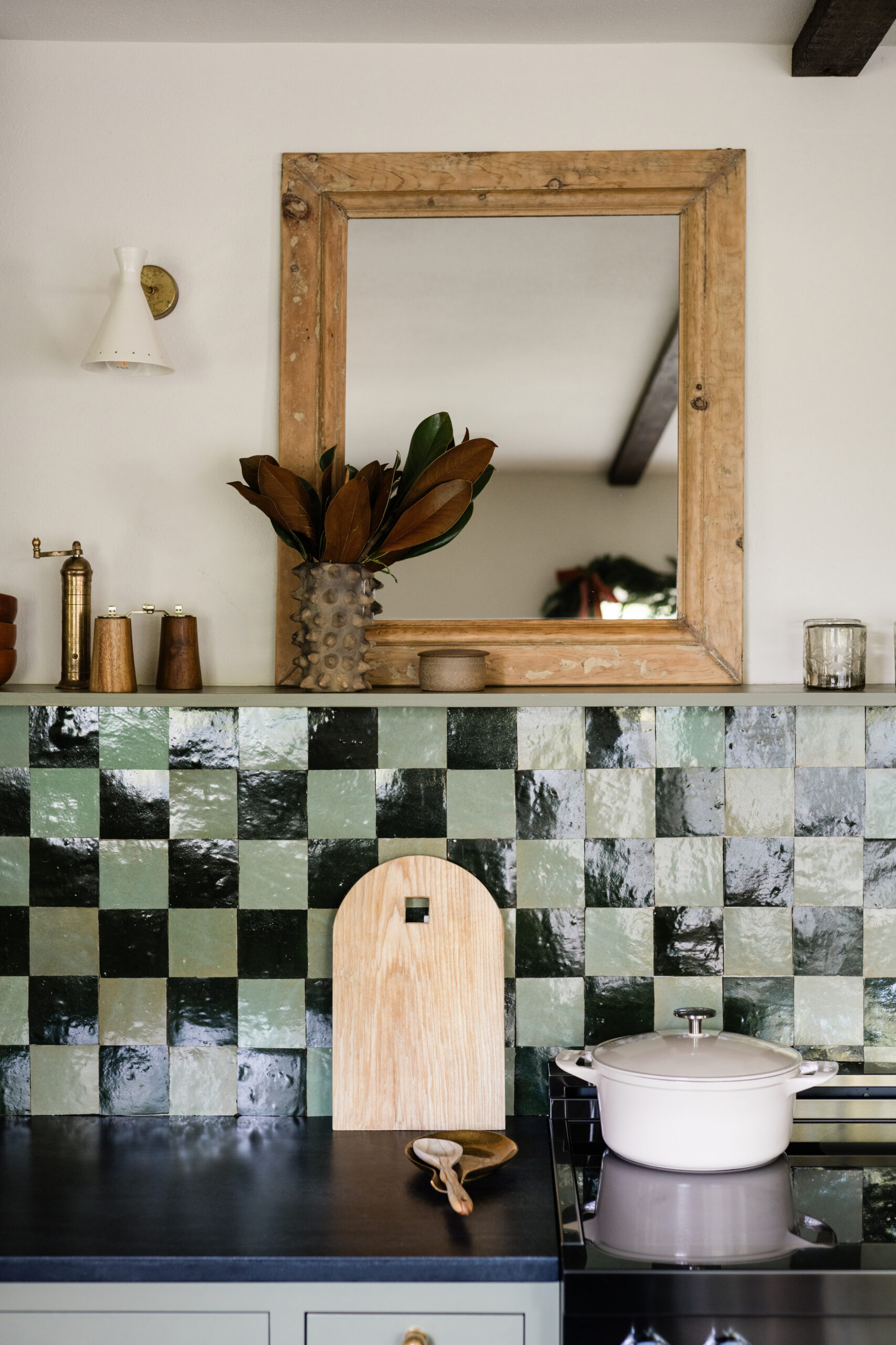 checkerboard zellige kitchen backsplash with magnolia leaves holiday decor