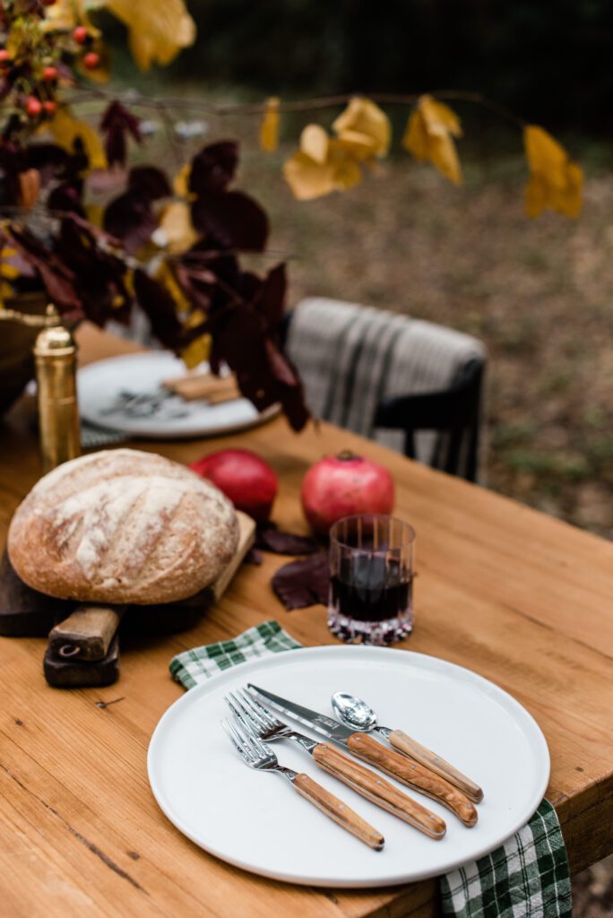 wood handled flatware and green plaid napkin decor for autumn harvest table