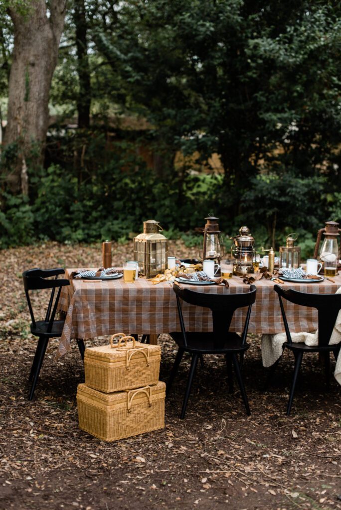 rustic camp inspired outdoor table design with fall color palette