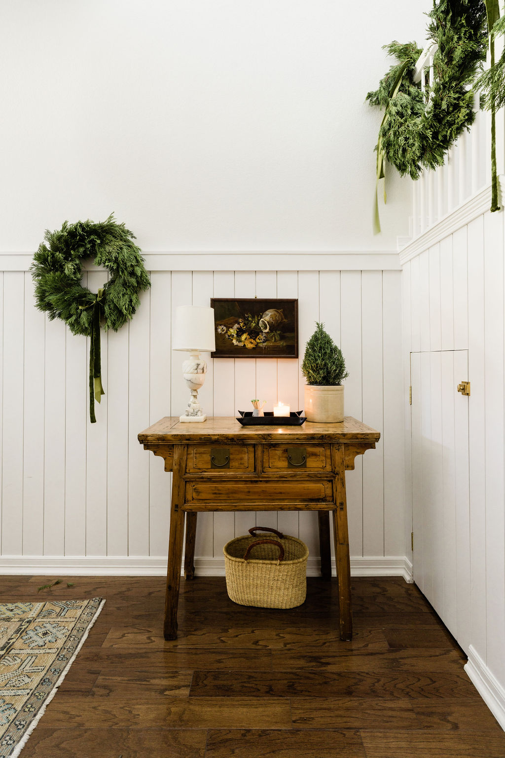 Entryway Christmas decor with fresh greens