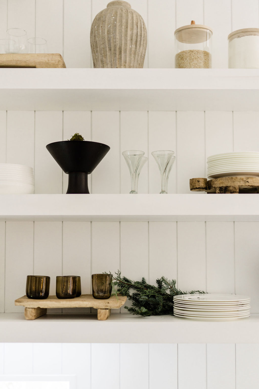 holiday decorating kitchen shelves with fresh greenery