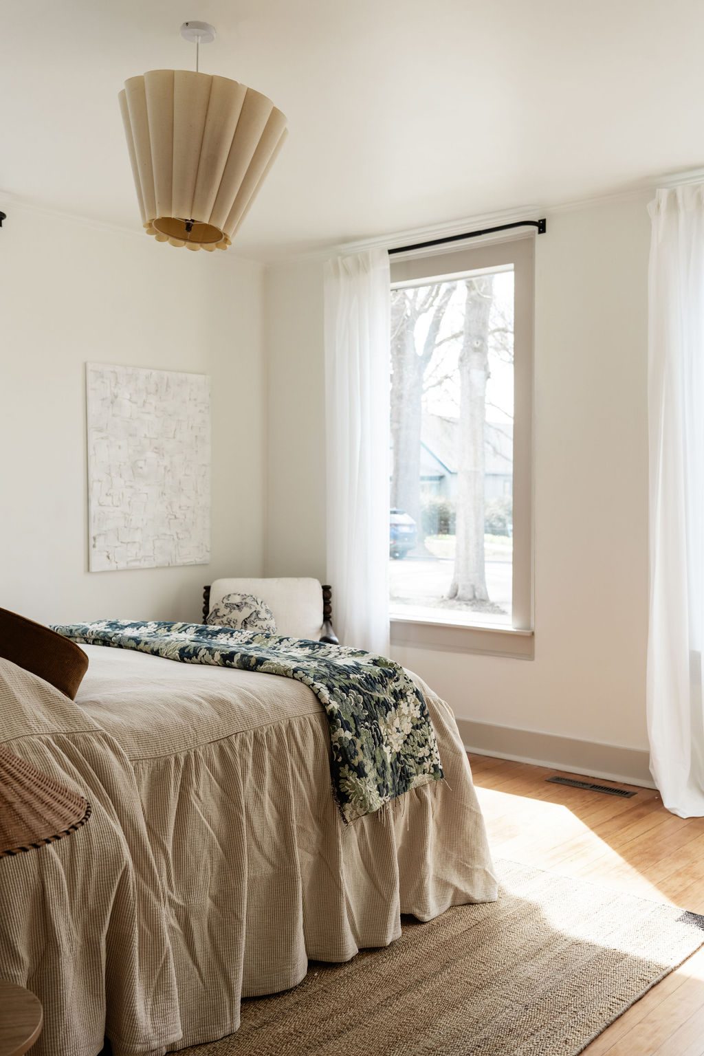 Bulbous Chandelier and Naturally Lit Bedroom