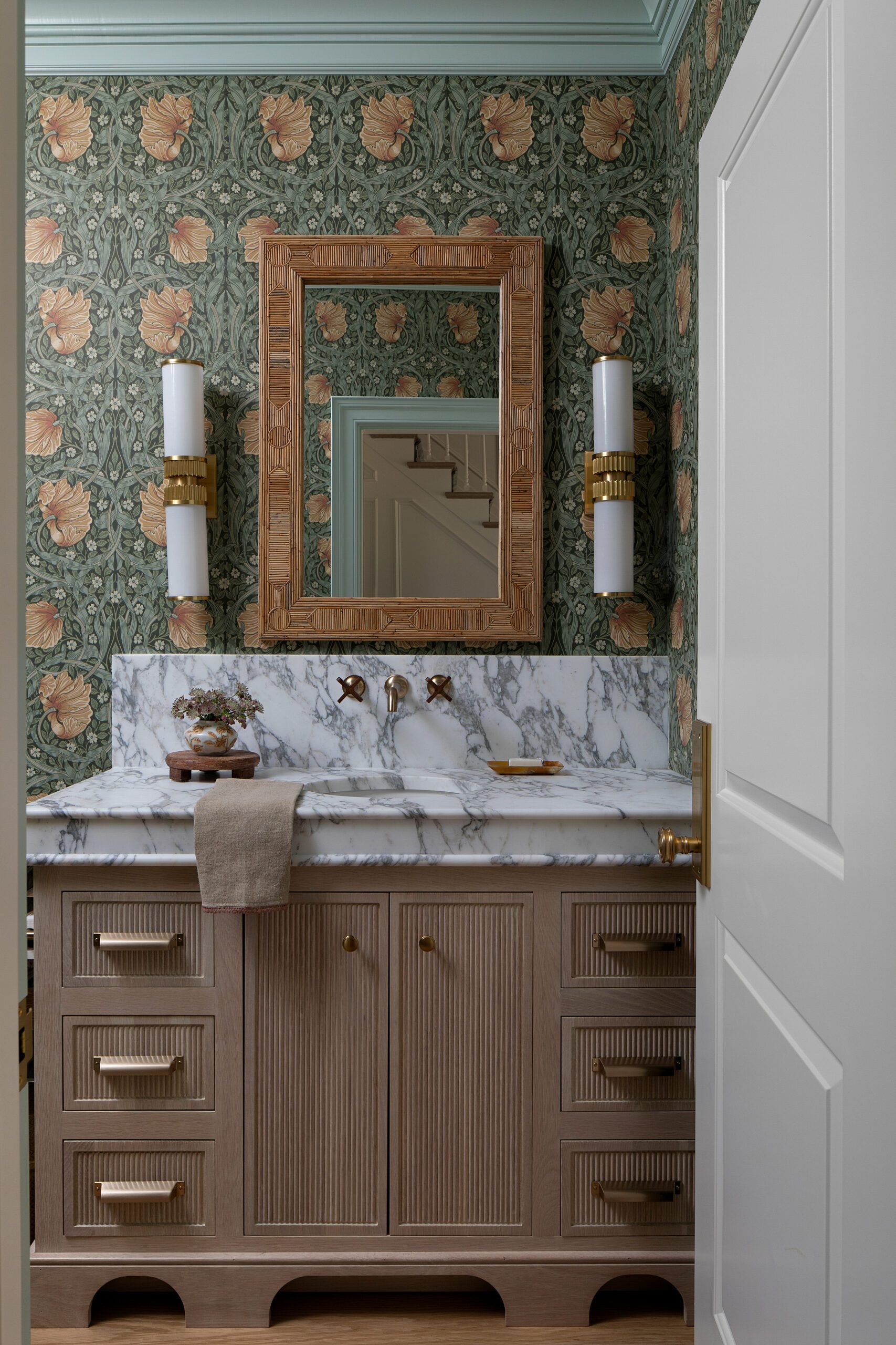 Wallpapered Bathroom with Marble Sink