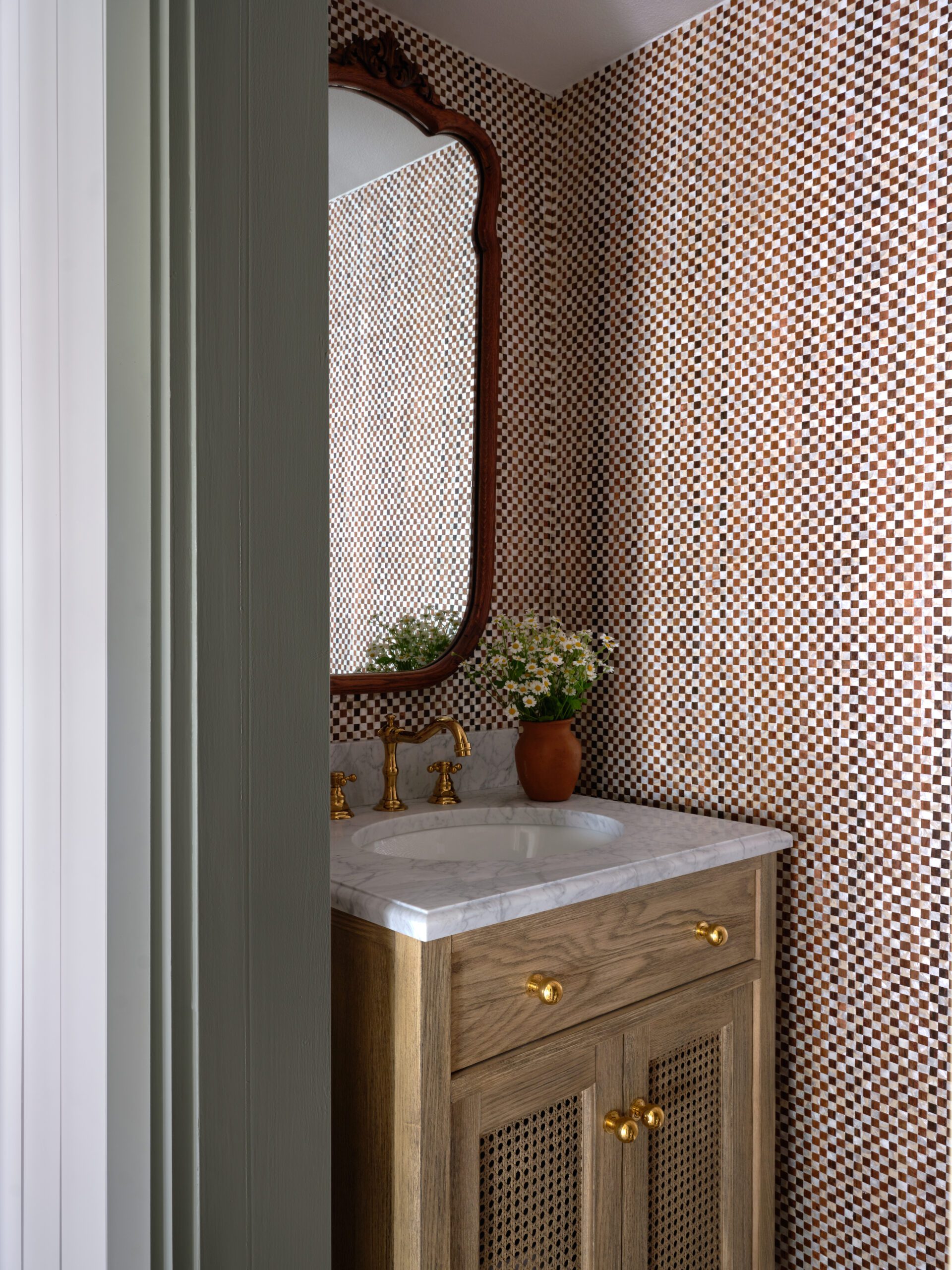 Mini checkerboard wall covering in powder bathroom