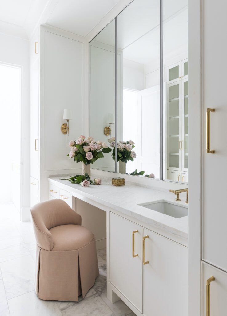 Modern, romantic bathroom suite with brass hardware and finishes by Marie Flanigan Interiors