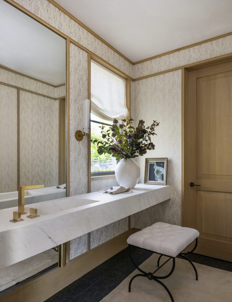 Modern romantic bathroom suite with brass hardware and finishes by Marie Flanigan Interiors