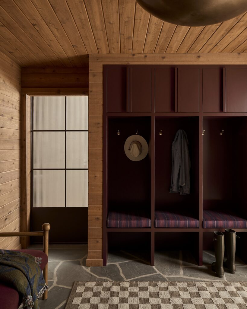 Brown mudroom cabinetry with locker style nooks