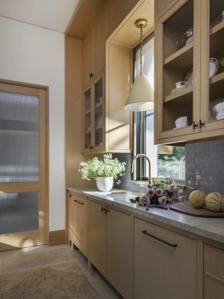 White oak cabinets featured in a butler's pantry by Marie Flanigan Interiors