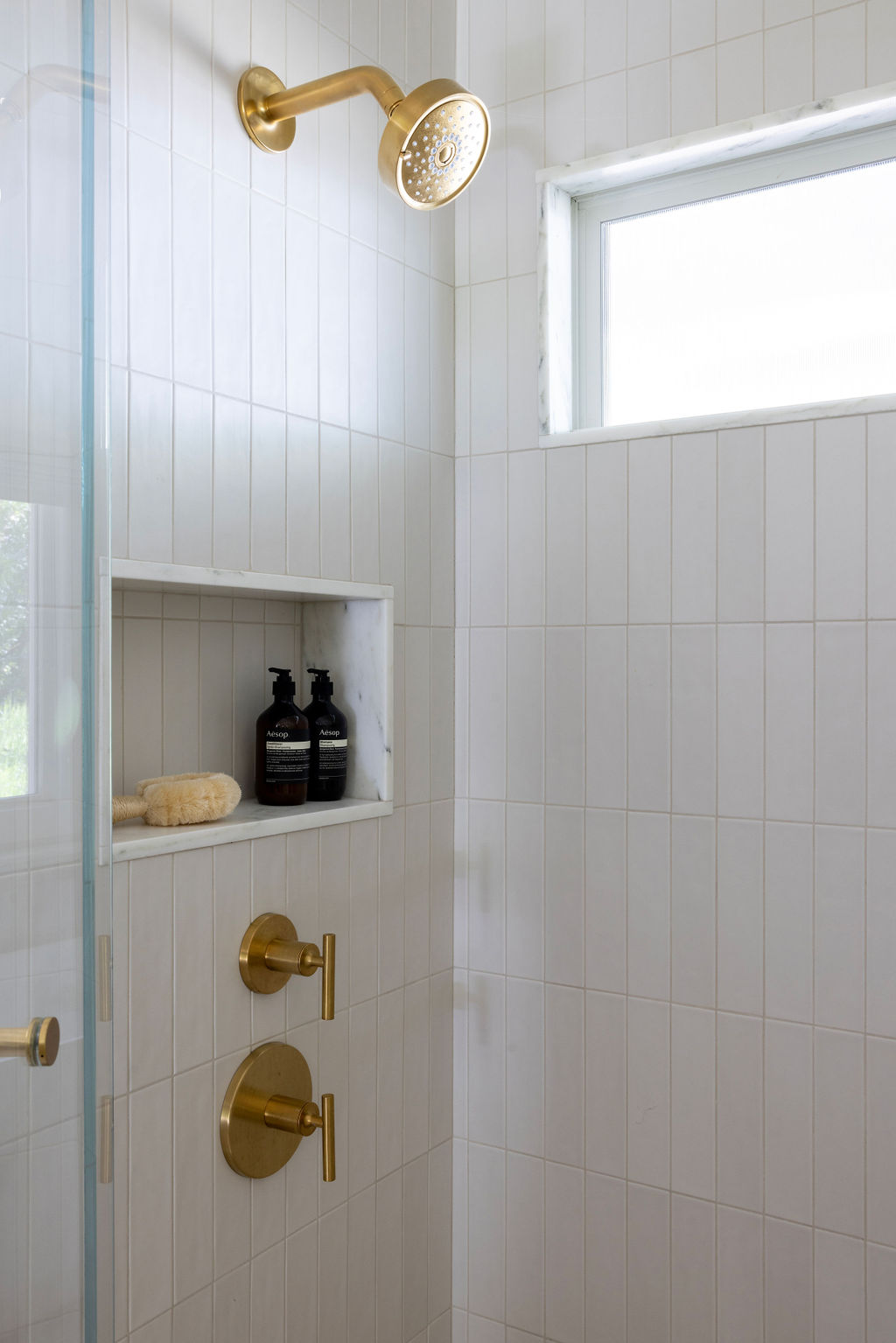 Cream Tiled Shower Gold Fixtures