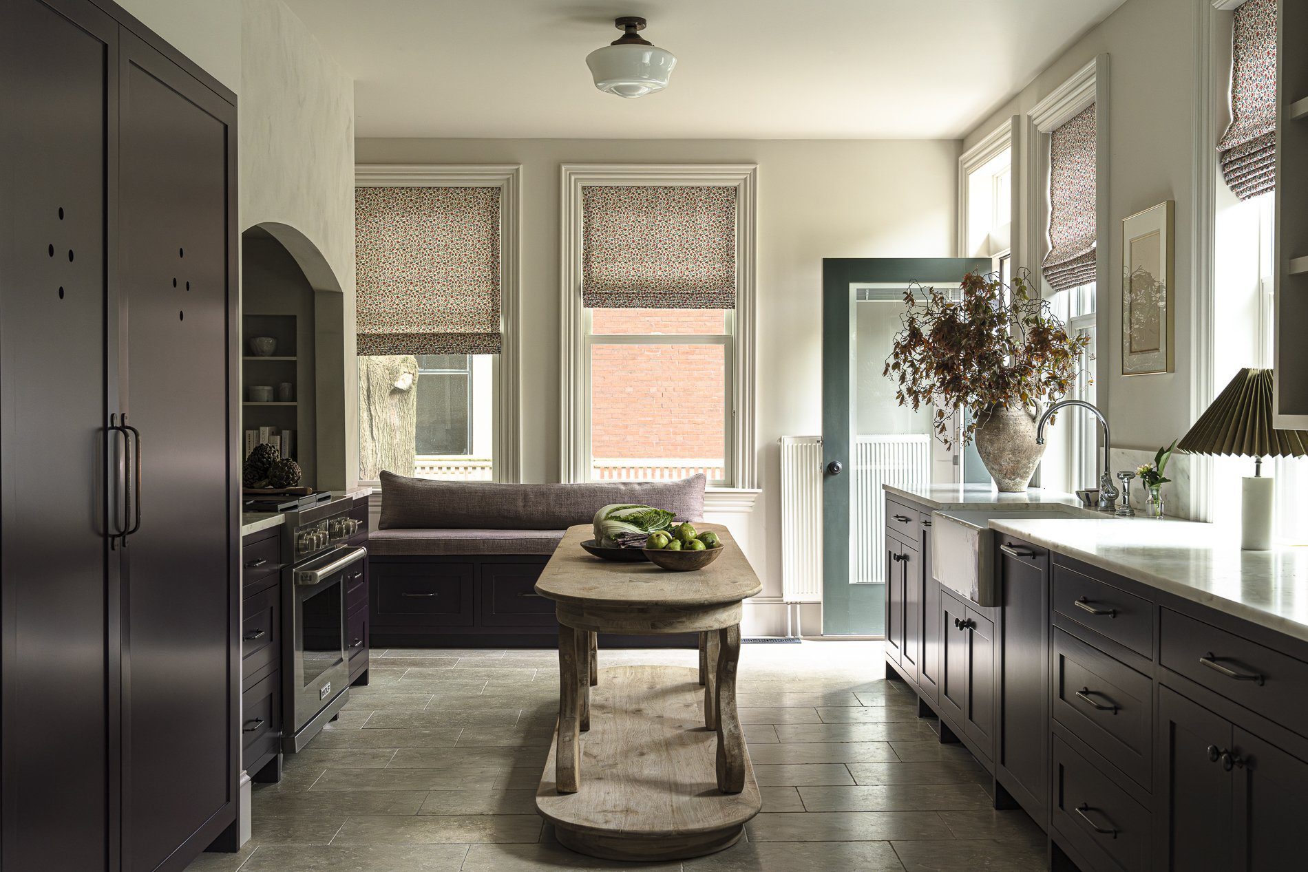 Plum kitchen cabinetry in a fall design inspired home