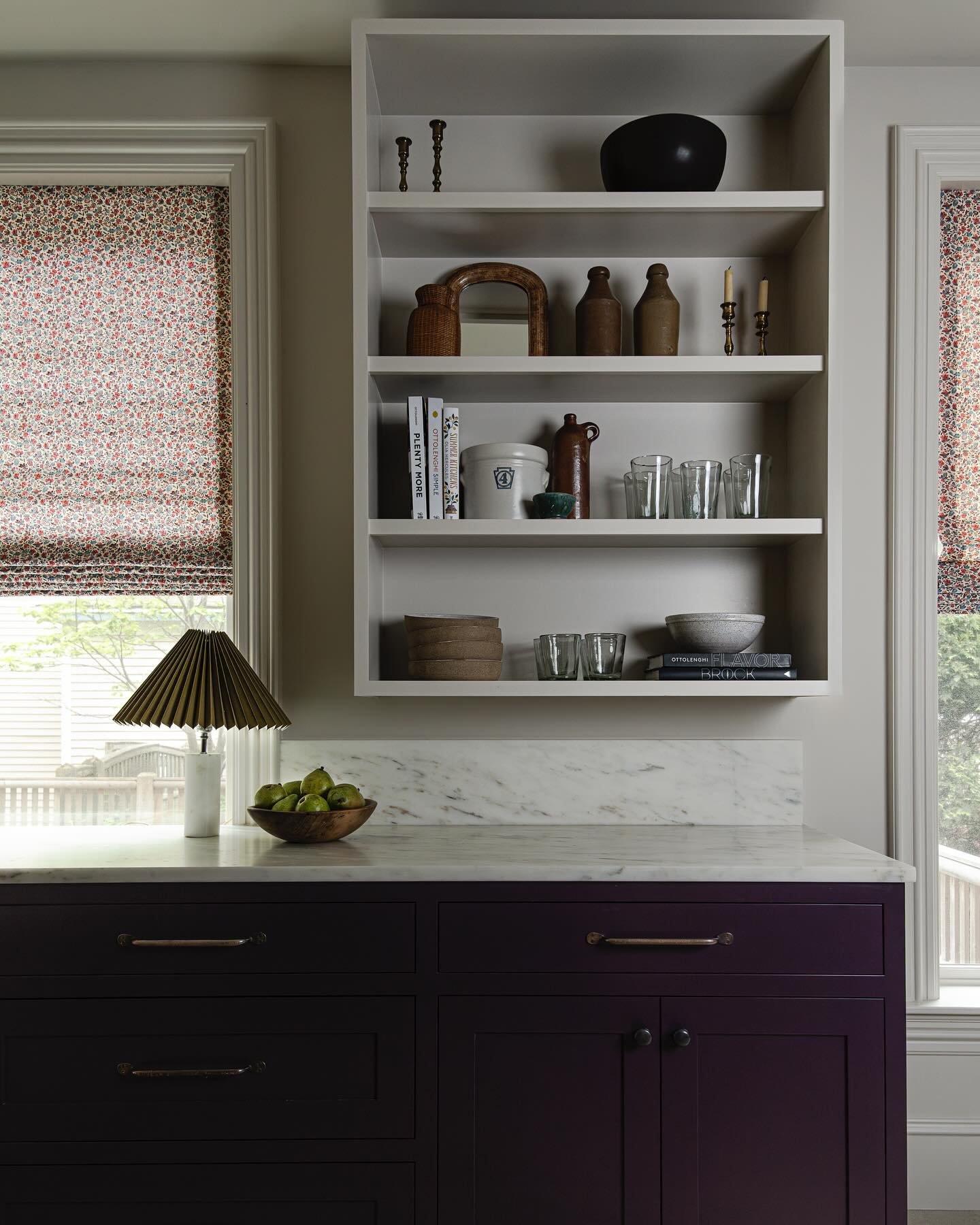 Plum kitchen cabinetry in a fall design inspired home