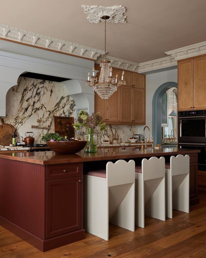 Red kitchen island with marble backsplash