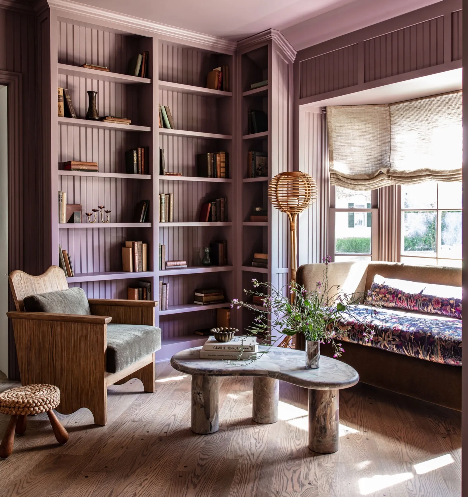 Mauve wall color in a living room by Jake Arnold