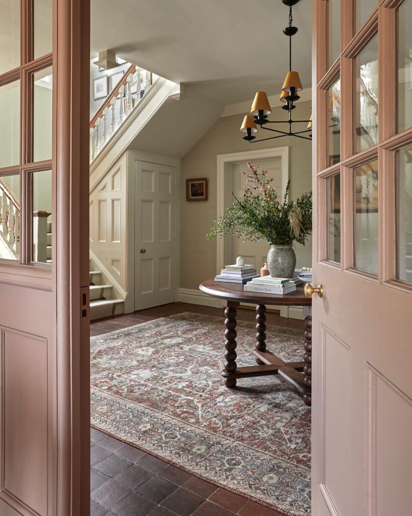 Mauve door color in an entry by Caisley Interiors