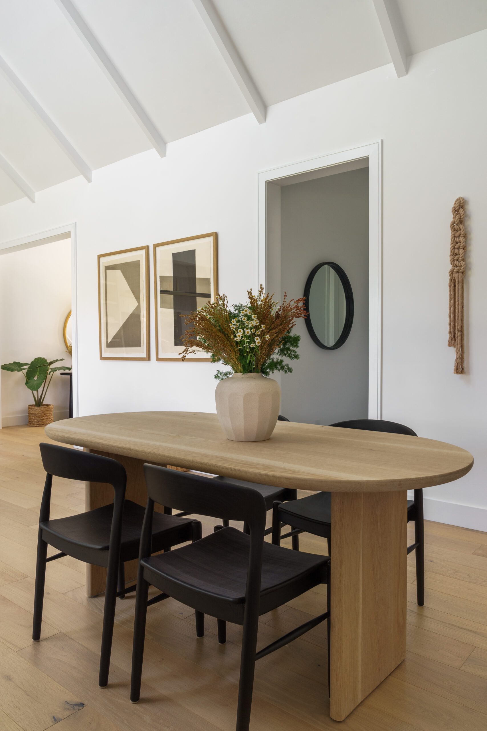 Wooden Dining Table with Black Chairs