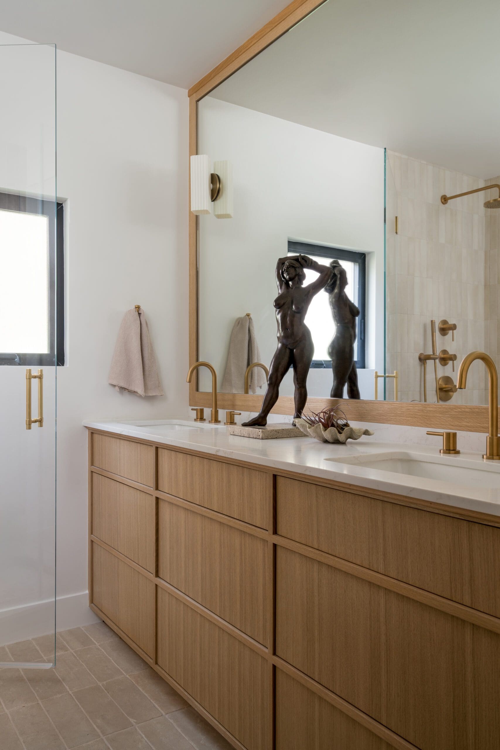 Double Vanity with a Sculpture