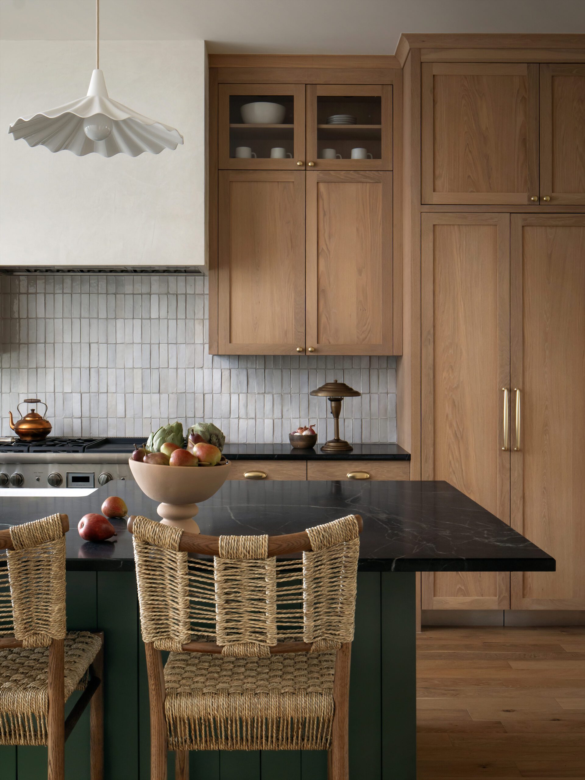 Tiled White Backsplash with Woven Chairs