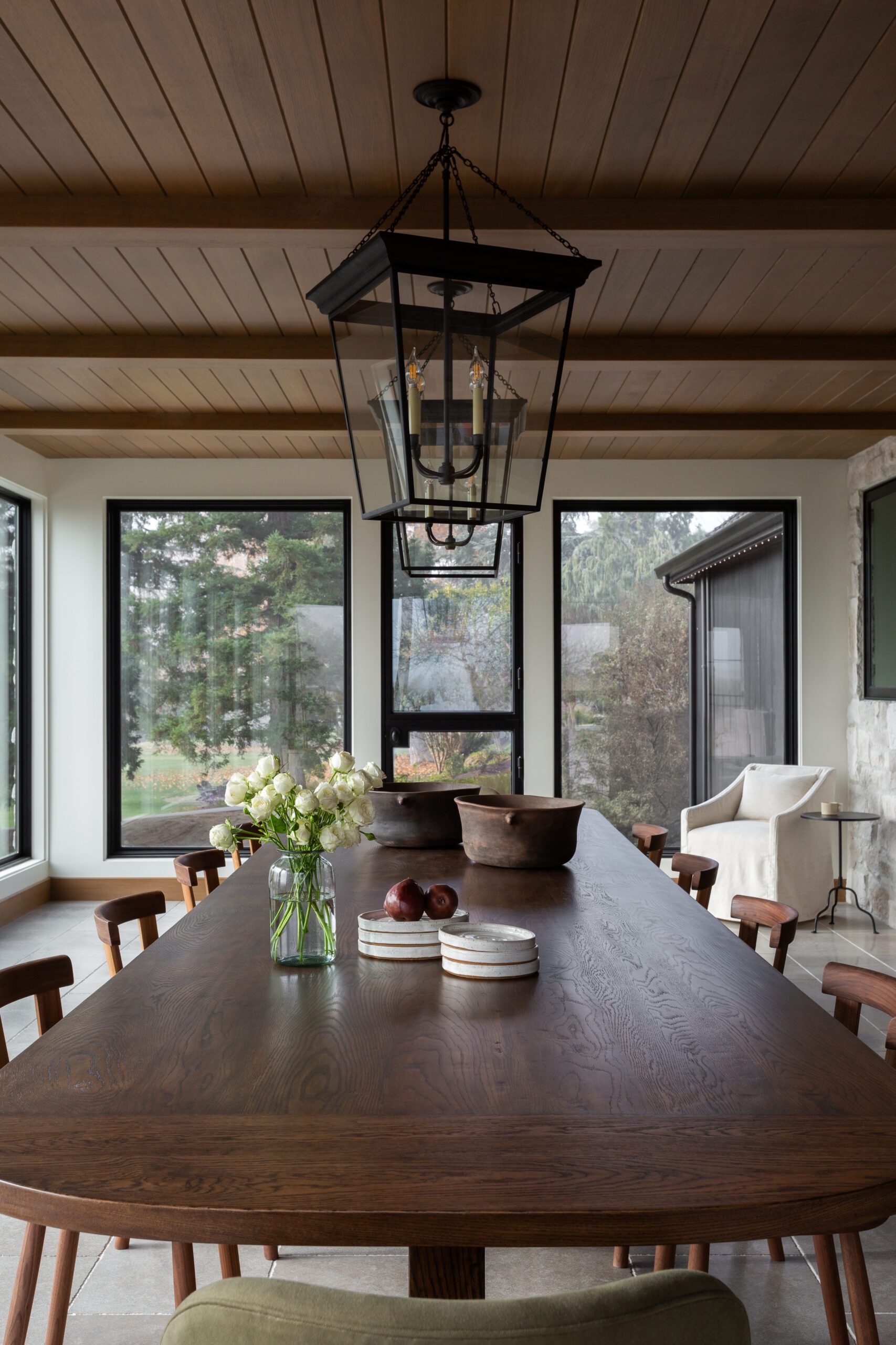 Long wooden dining table iron light fixtures