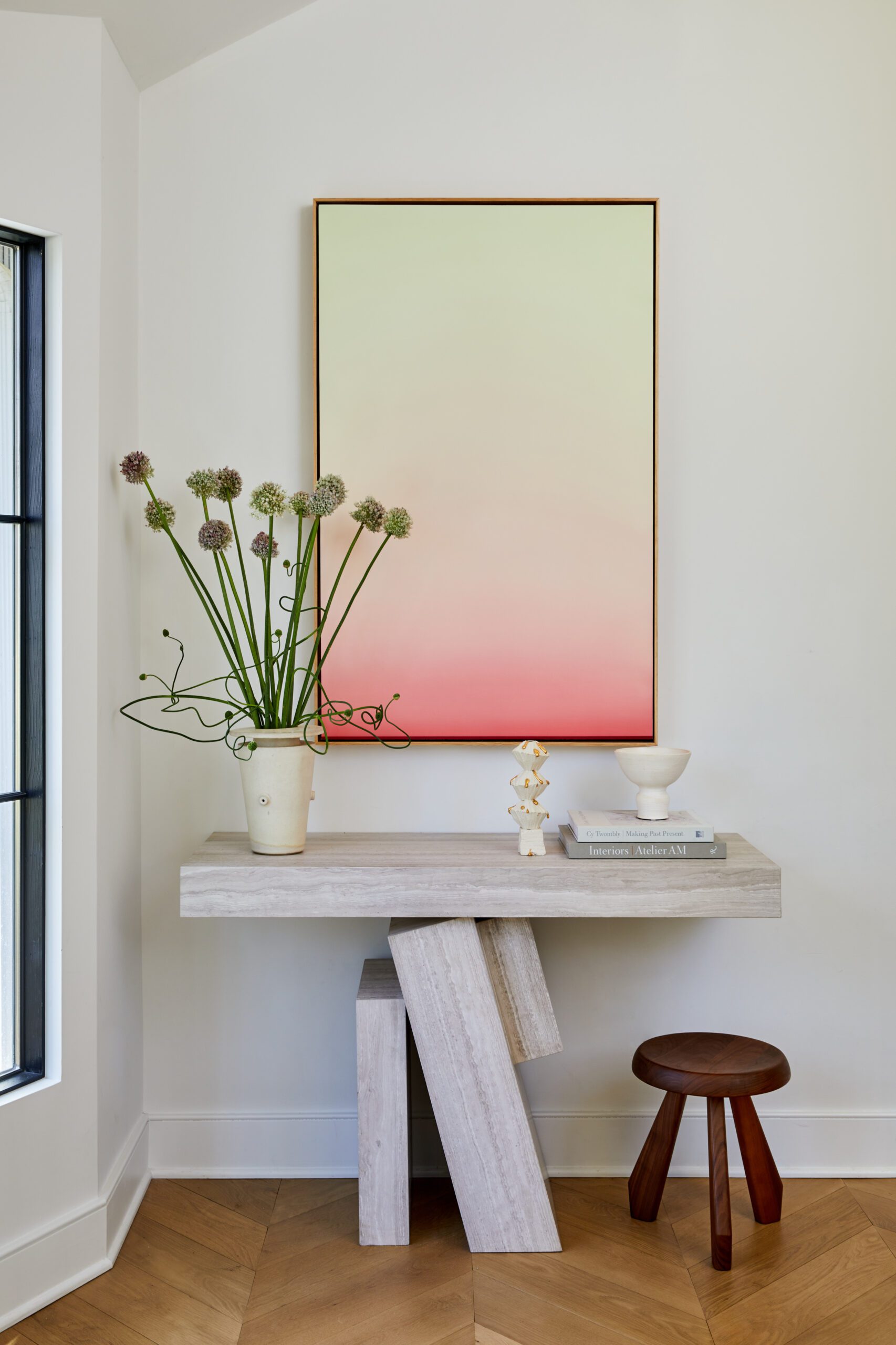 Entryway with colorful artwork and flowers