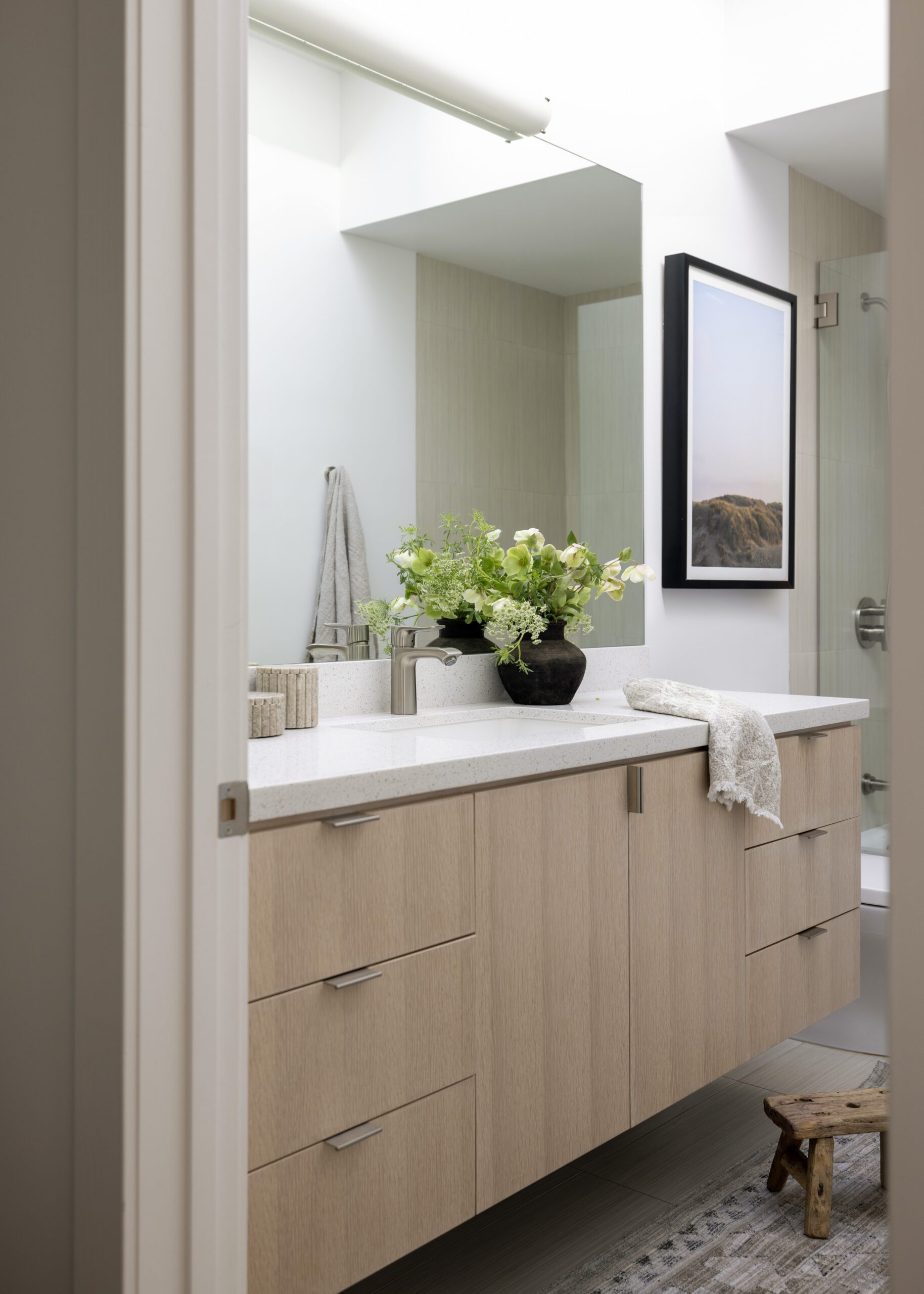 Guest bathroom details wood cabinets