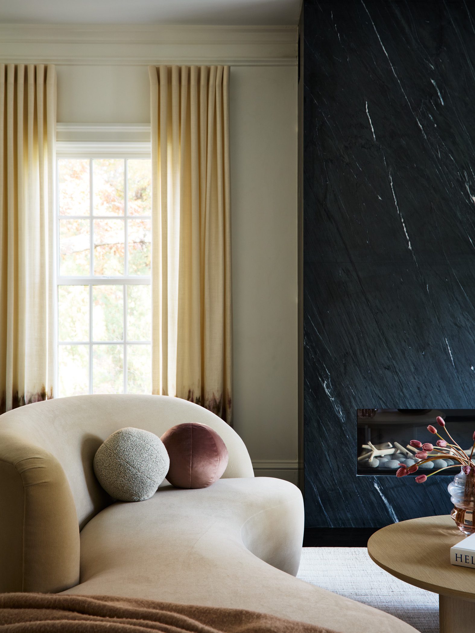 Fireplace with curved sofa