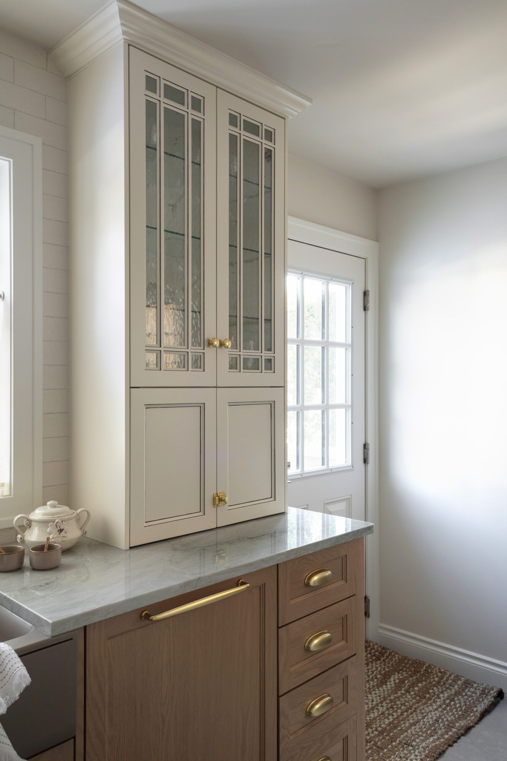 Tall white glass cabinets