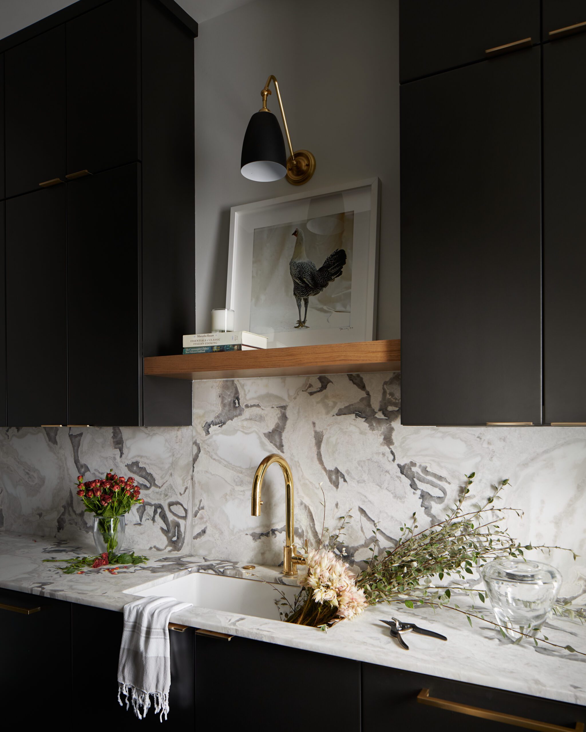 Golden Kitchen Faucet and Black Cabinets