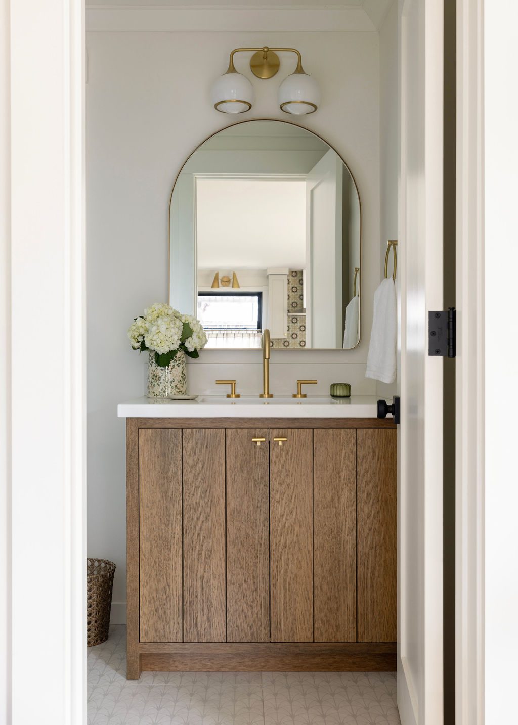 Bathroom cabinet with arched mirror