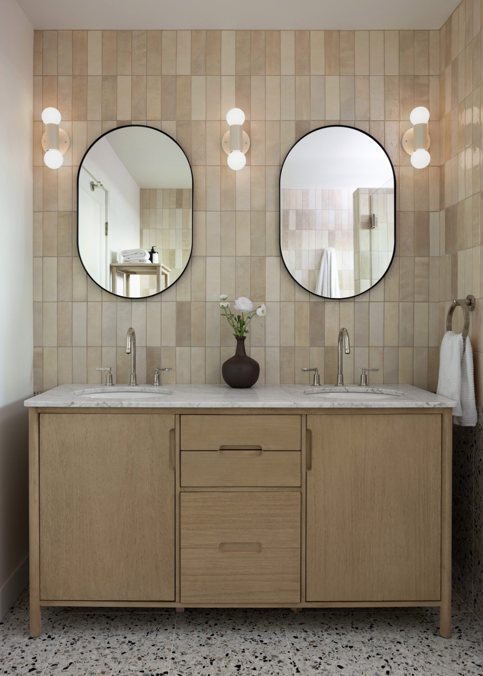 Double Vanity With Tiles and Circle Mirrors