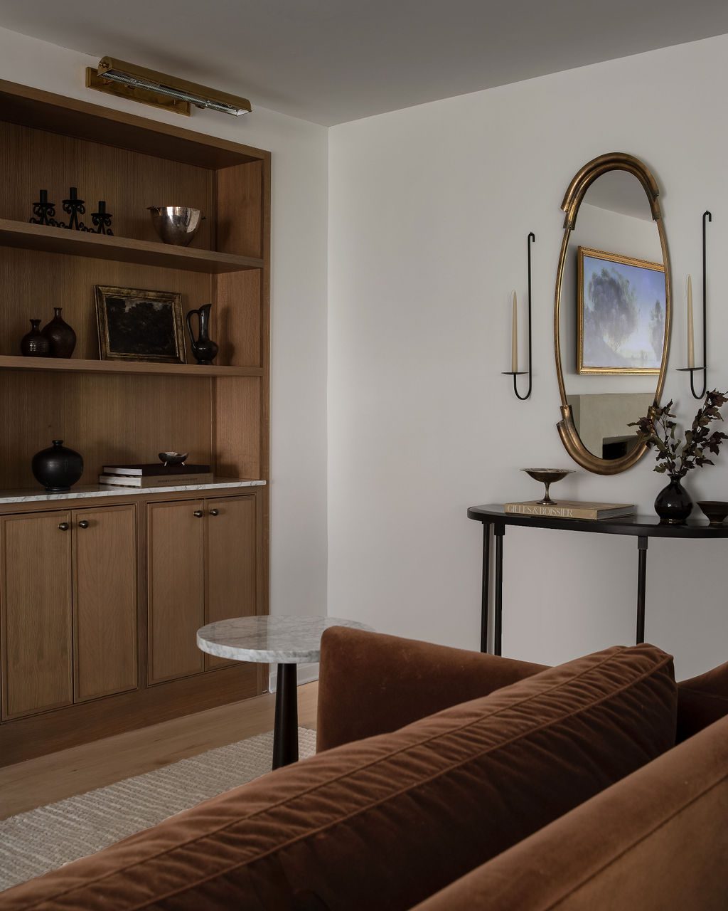 Oval Mirror and Built-In Shelving