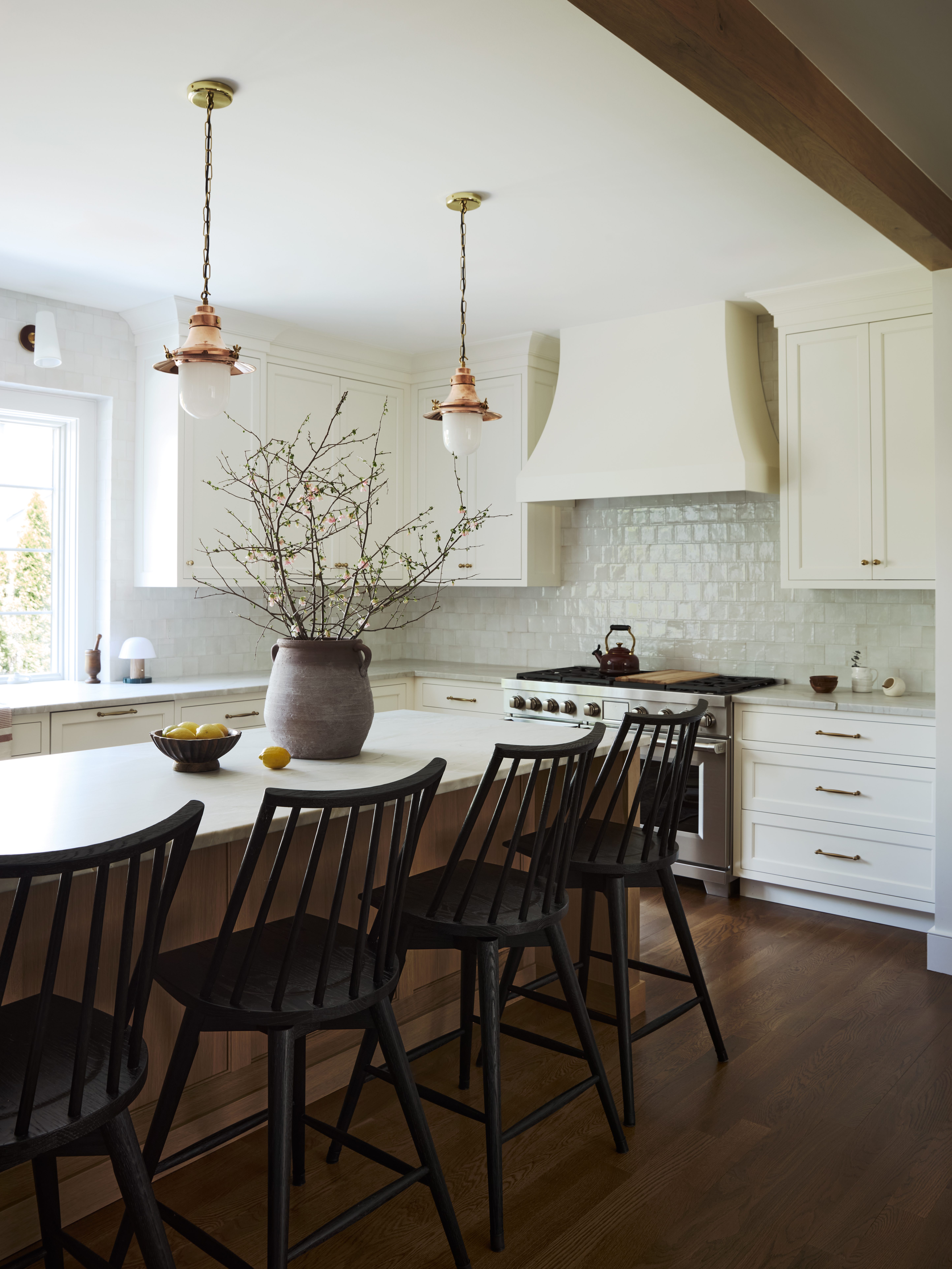 Kitchen island with black chairs modern design rangehood