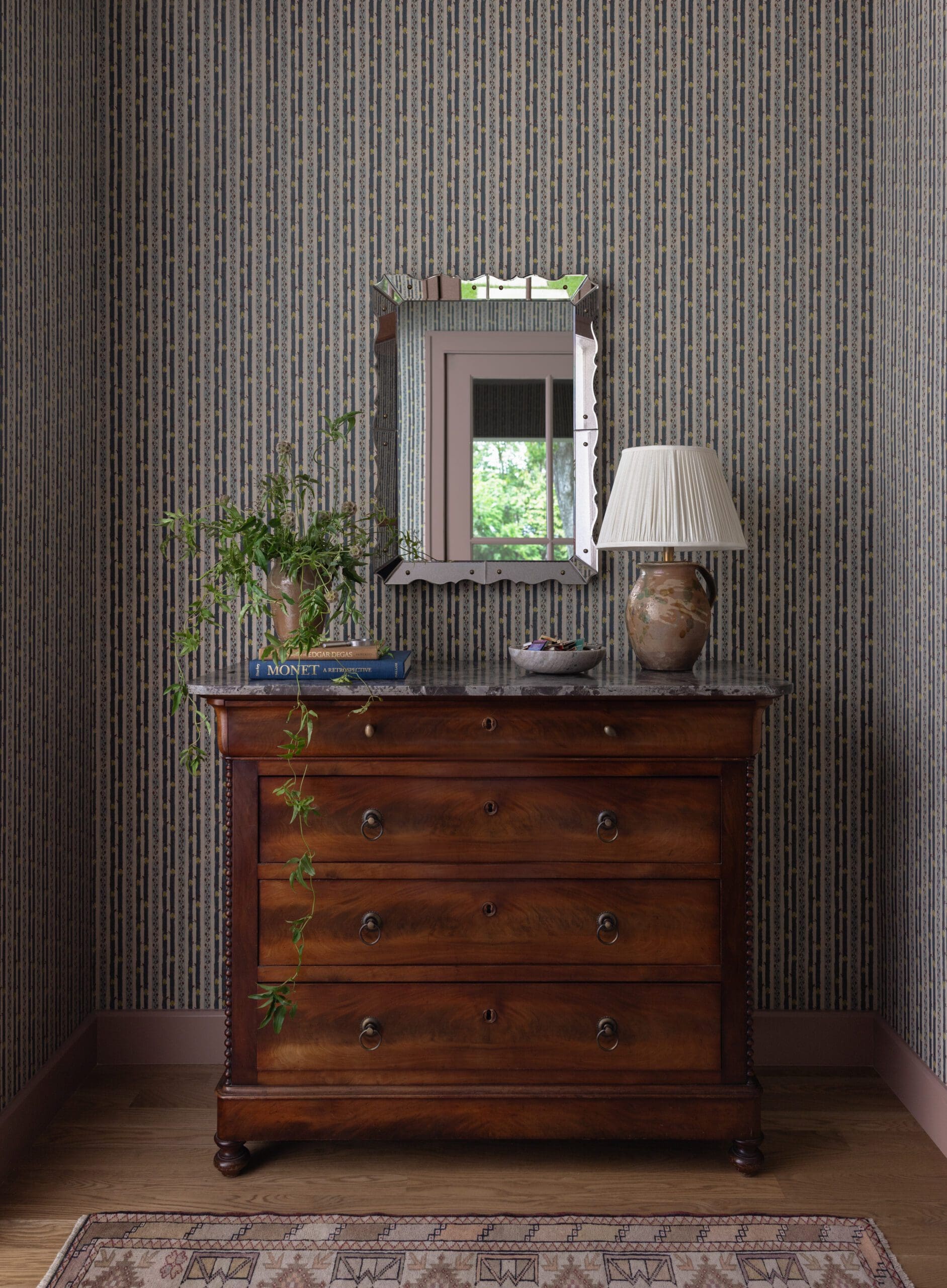 Antique cabinet with iron mirror details