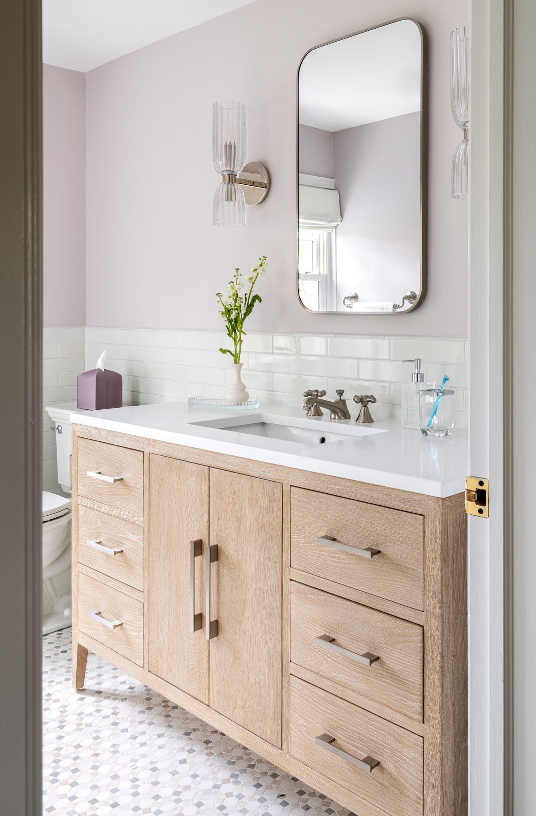 Updated bathroom renovation white tile pink walls