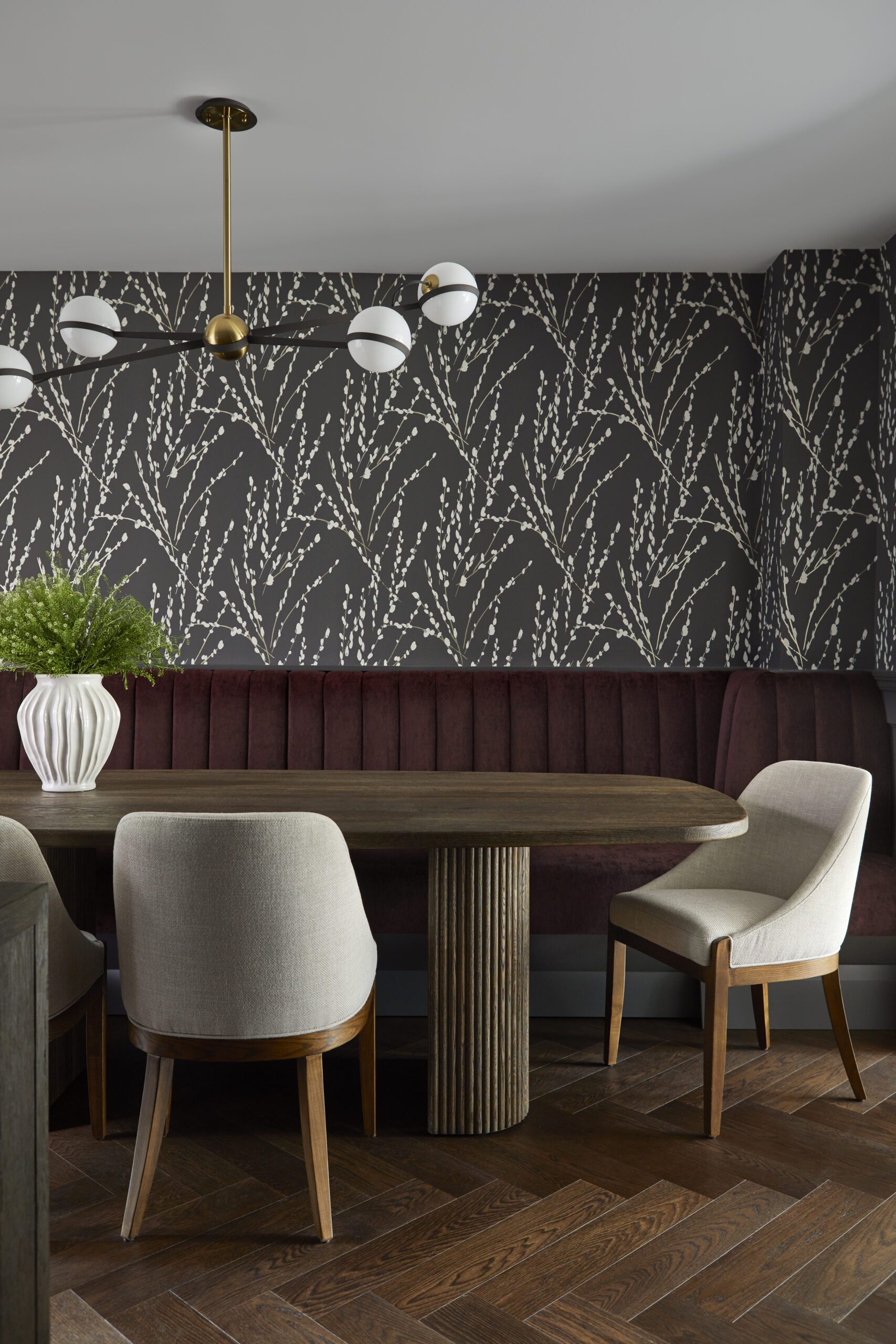 Modern dining room table wallpapered walls