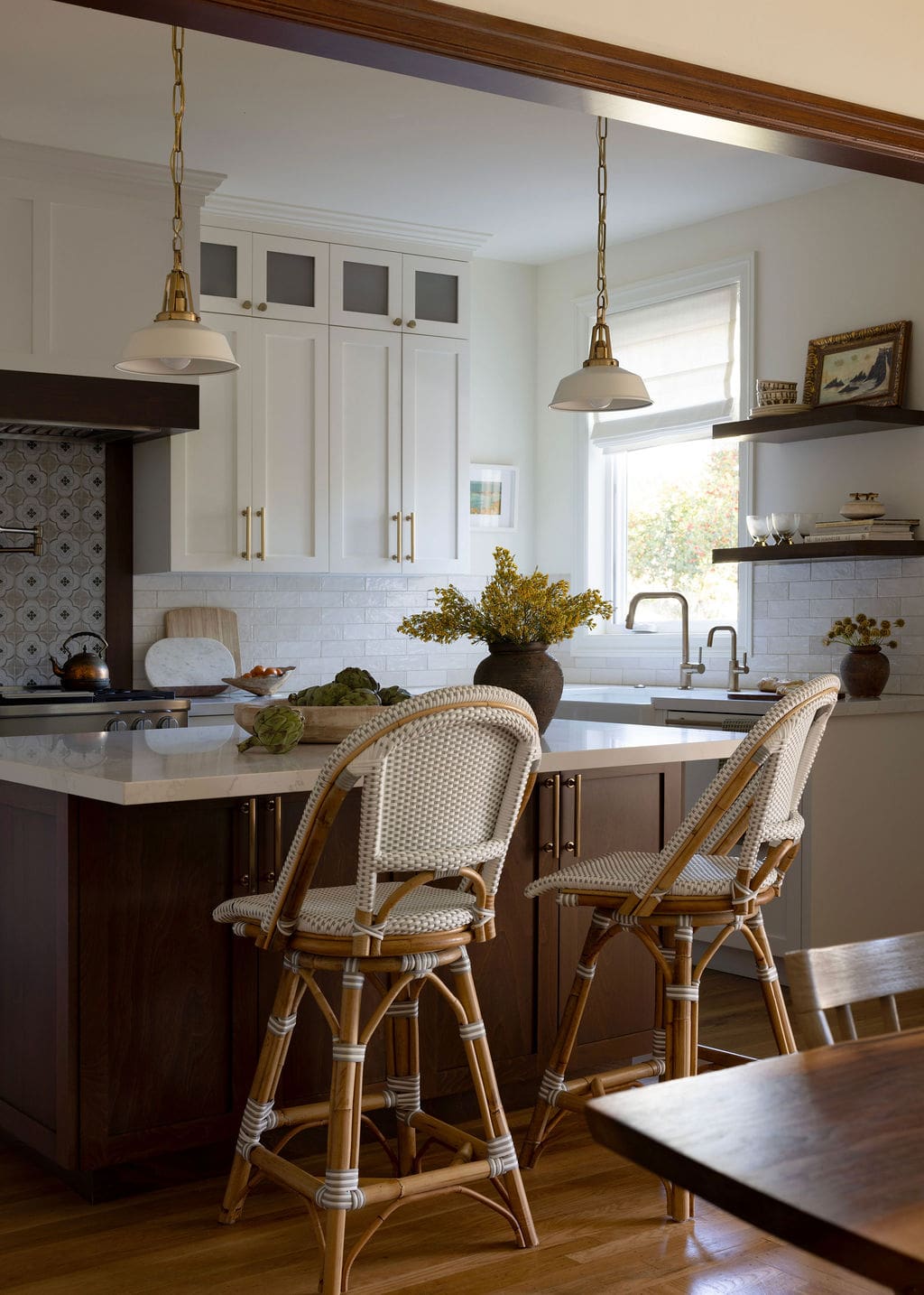 Kitchen with pendant light and chairs