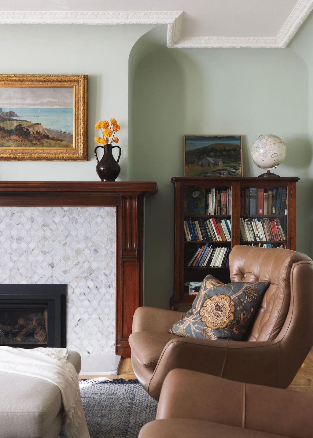 Living room with fireplace and reading chair