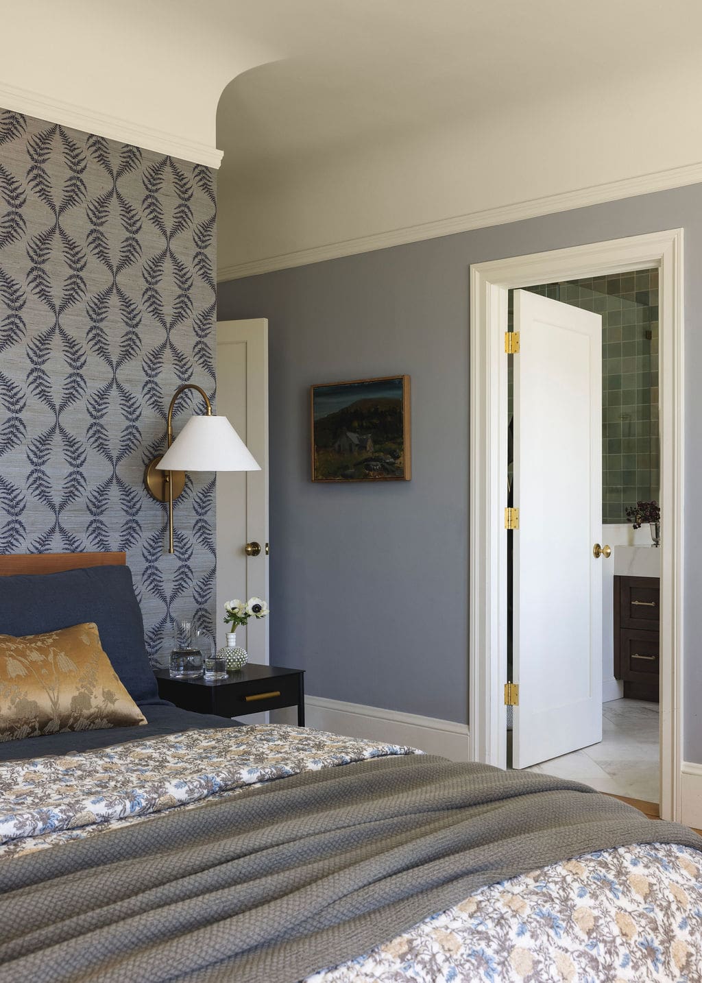 Bedroom with navy grasscloth wallpaper