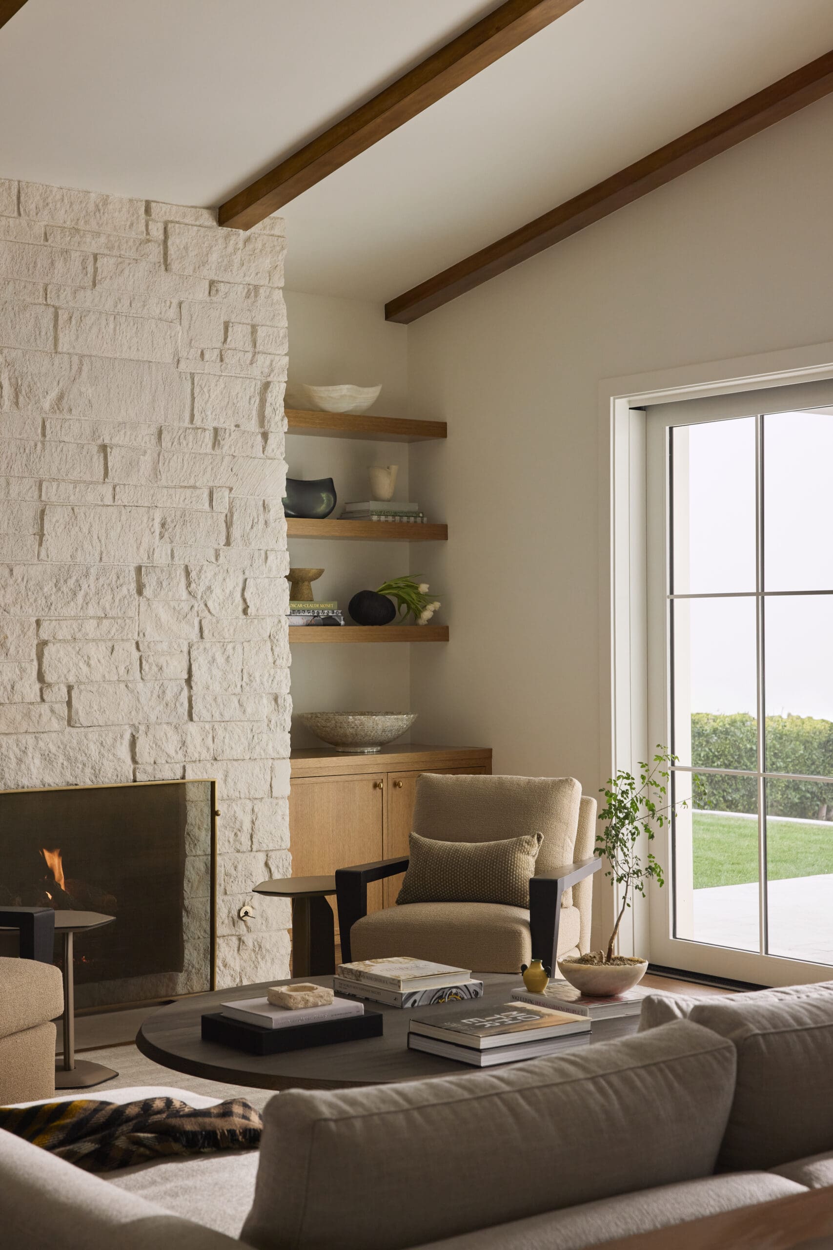 Living room with fireplace and lounge chair