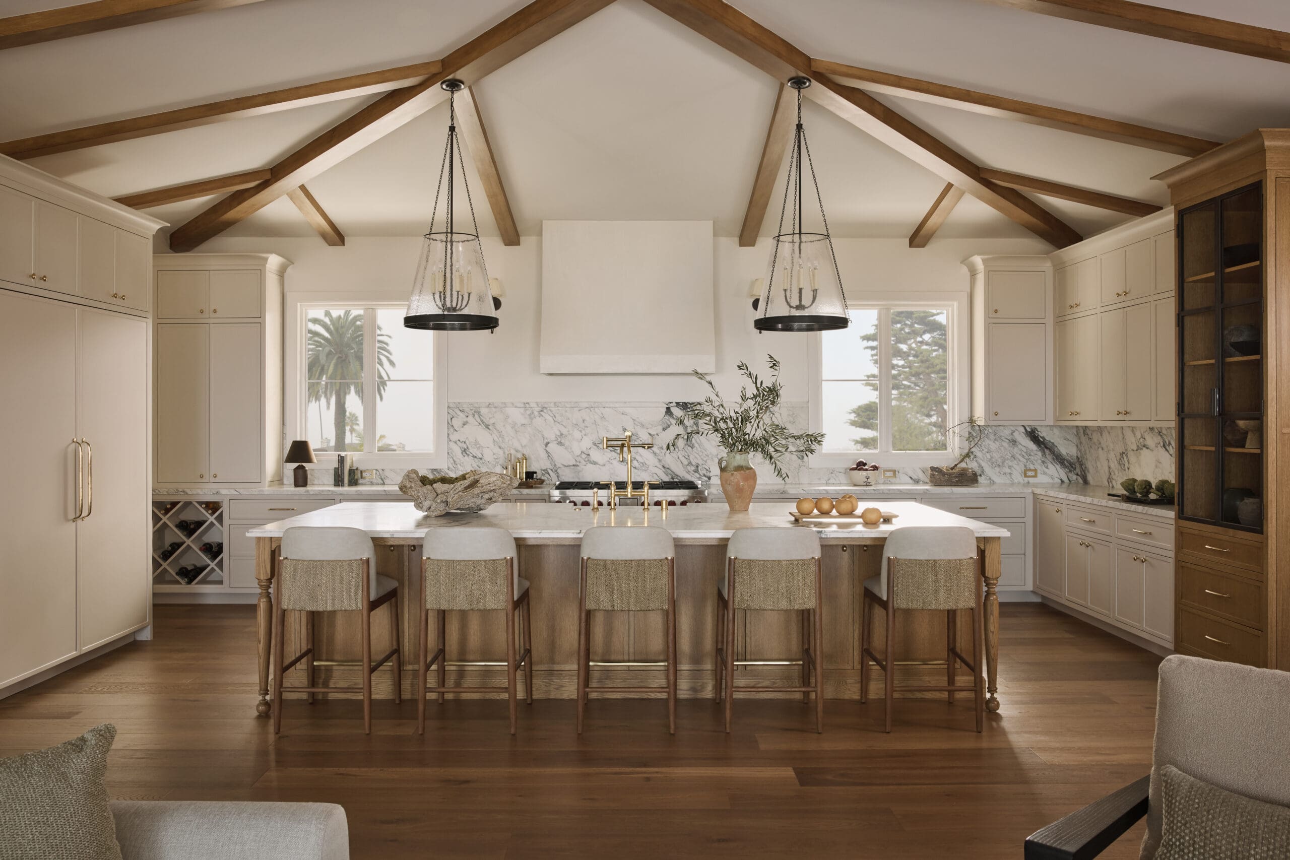 White kitchen with island and chairs