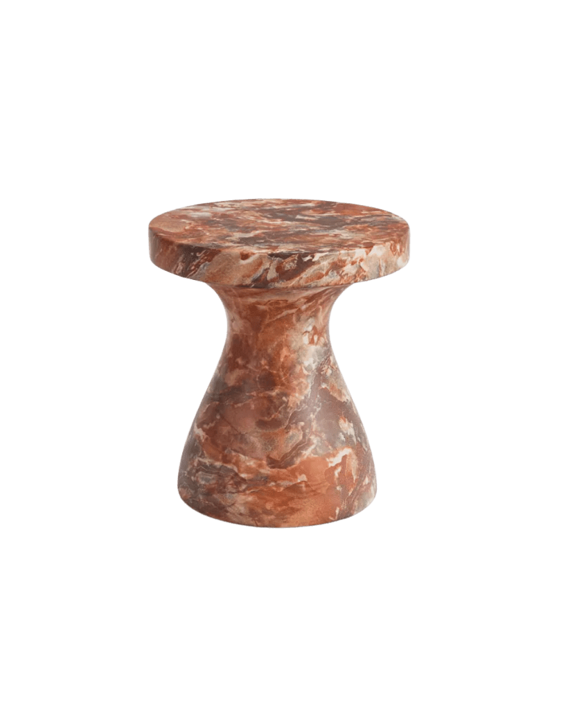 Red marble pedestal table with a round top and flared base, compact and sculptural