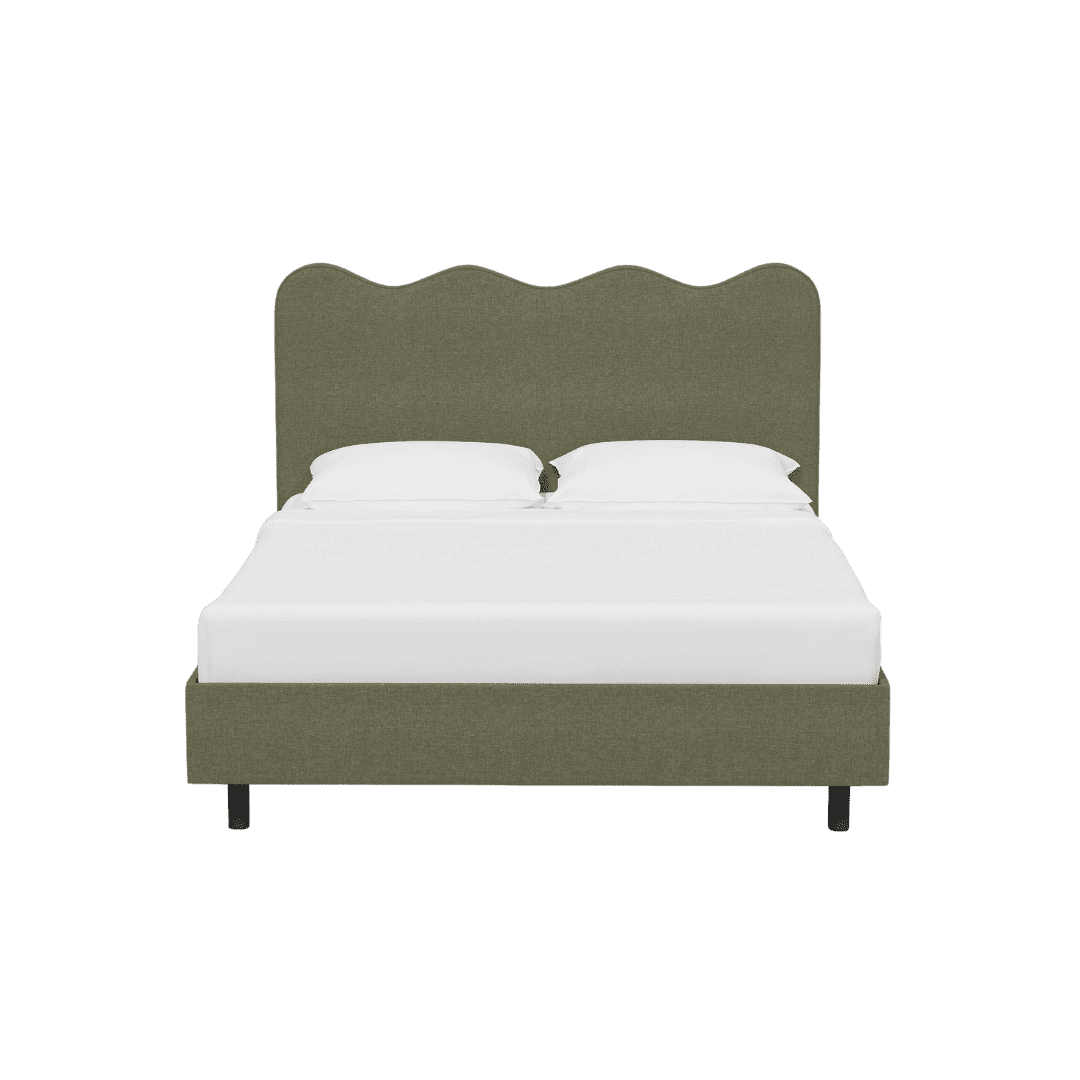 Olive-green upholstered bed with scalloped headboard and white bedding, two pillows visible.