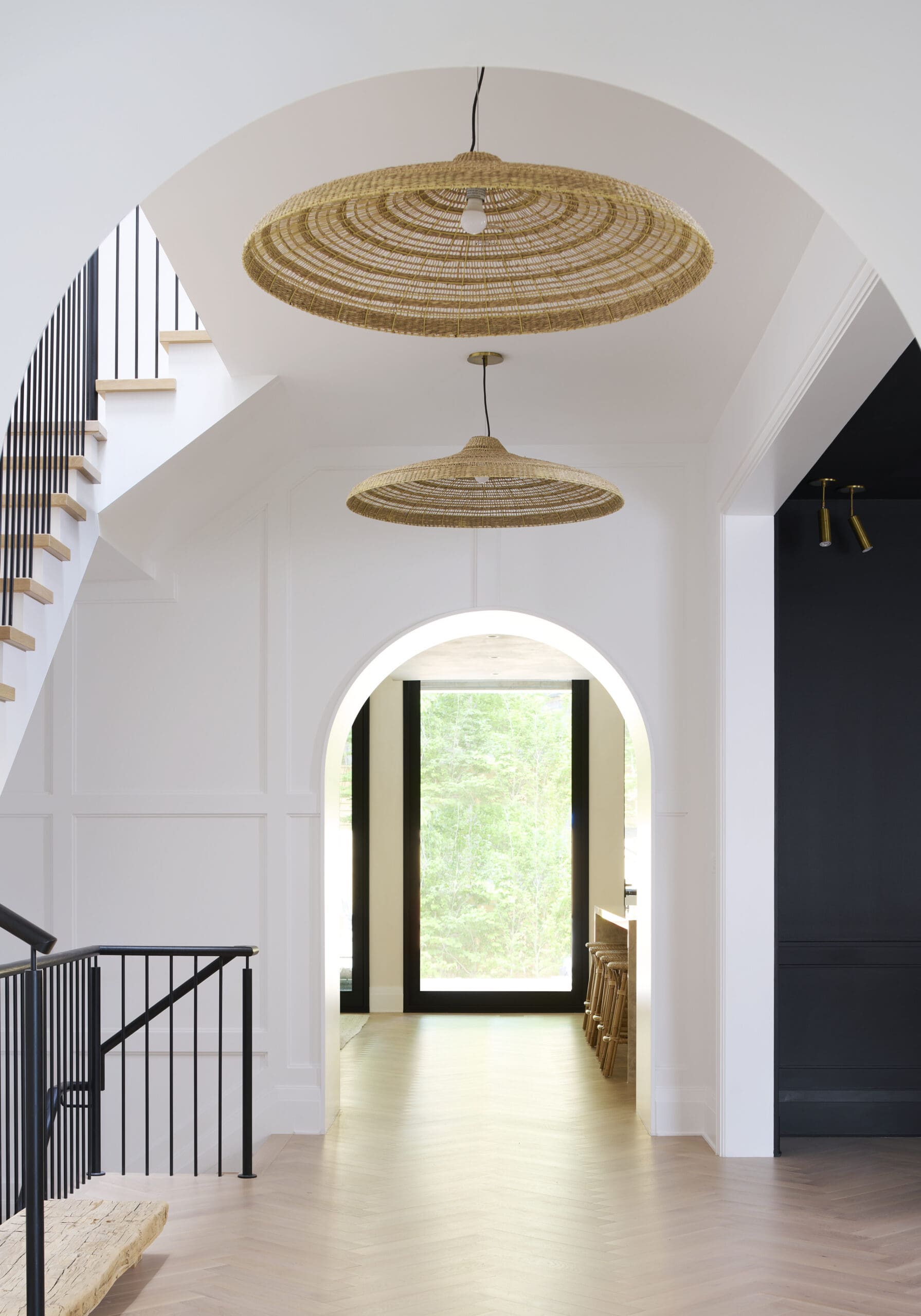 Entryway hallway with rattan pendant lights