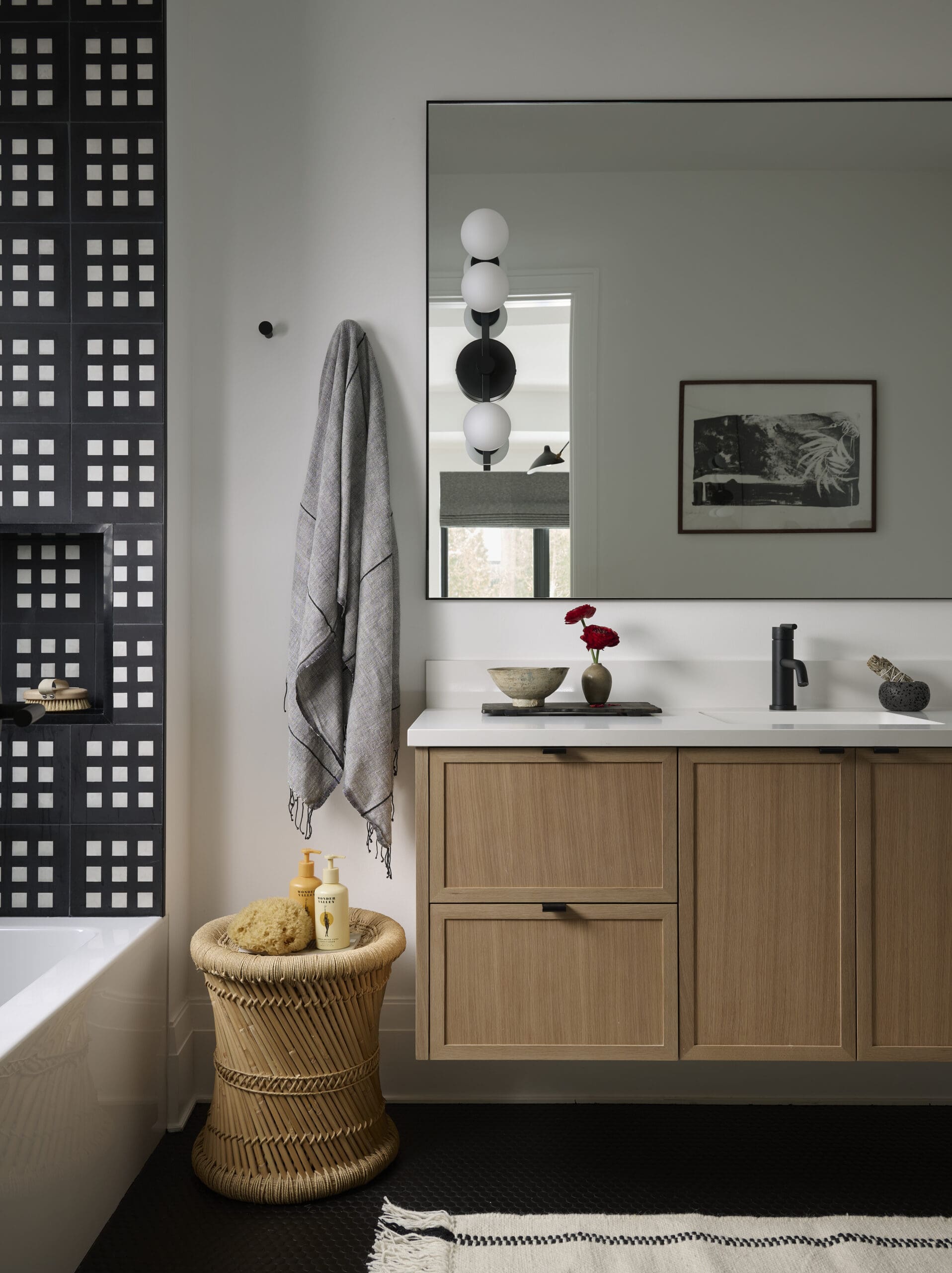 Bathroom with black and white tile