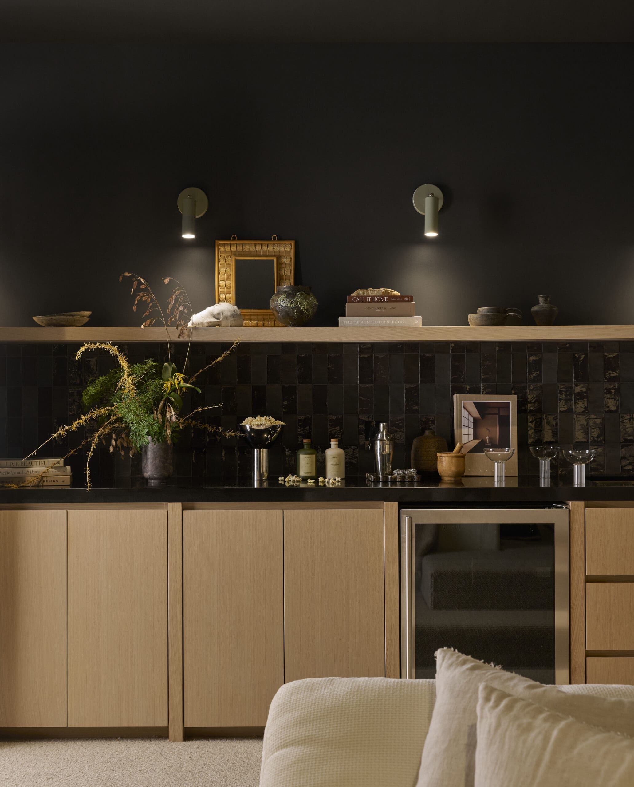 Black walls with oak cabinetry